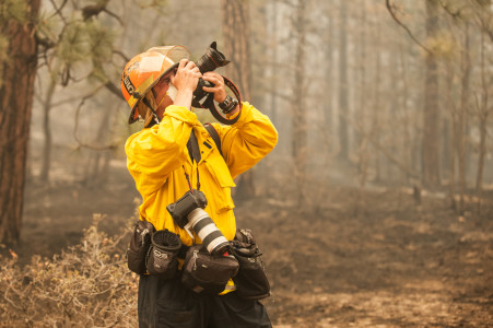 Photojournalist David Kadlubowski with the Arizona Republic shoots the fire.