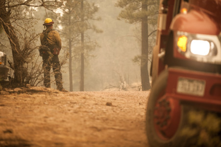 A firefighter from Telluride, Colorado takes a break from fighting the Wallow Fire.